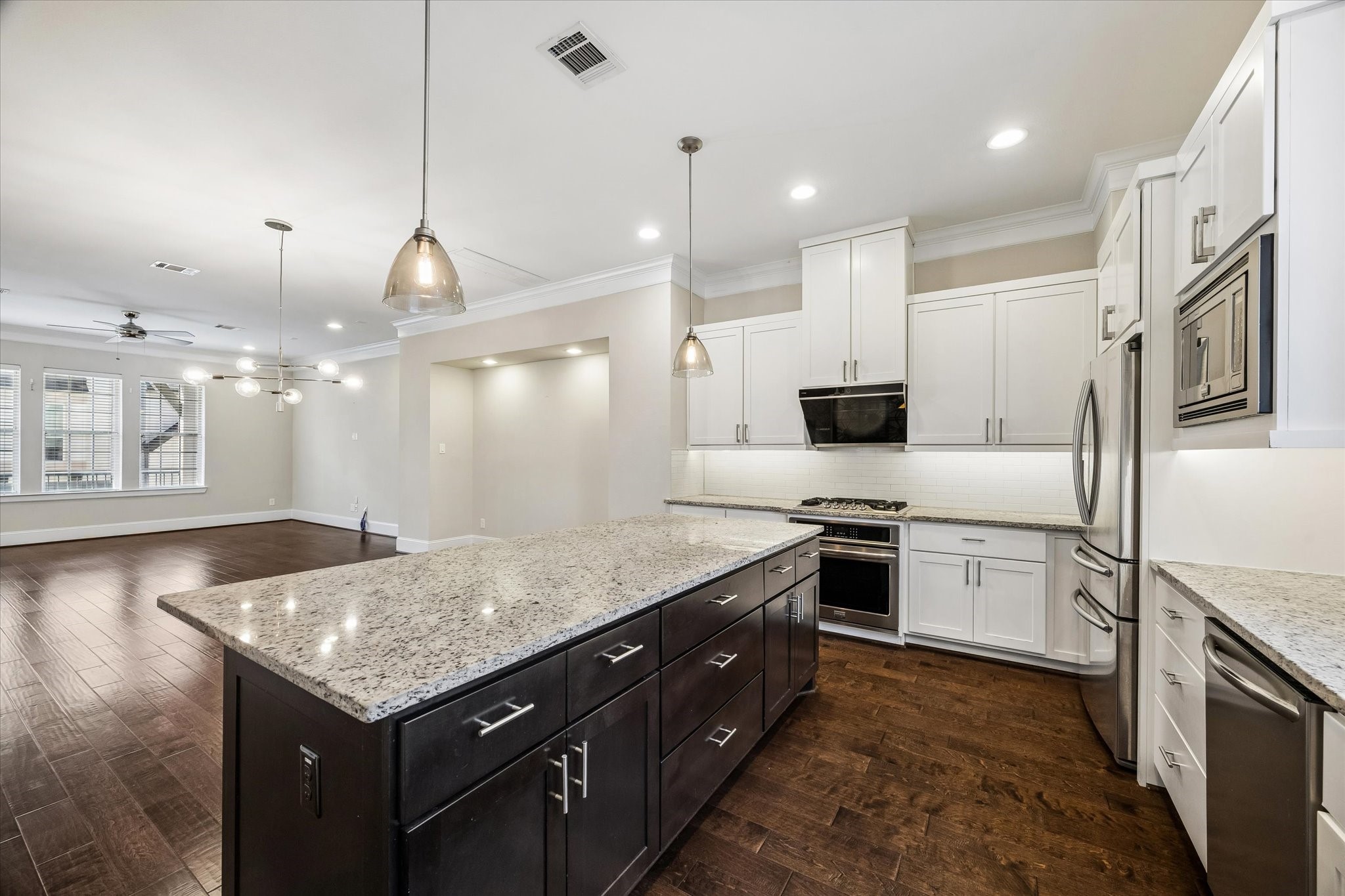 8318 Ginger Oak Street Houston, TX 77055 - Photo 4 of 20 a kitchen with a sink stove and refrigerator