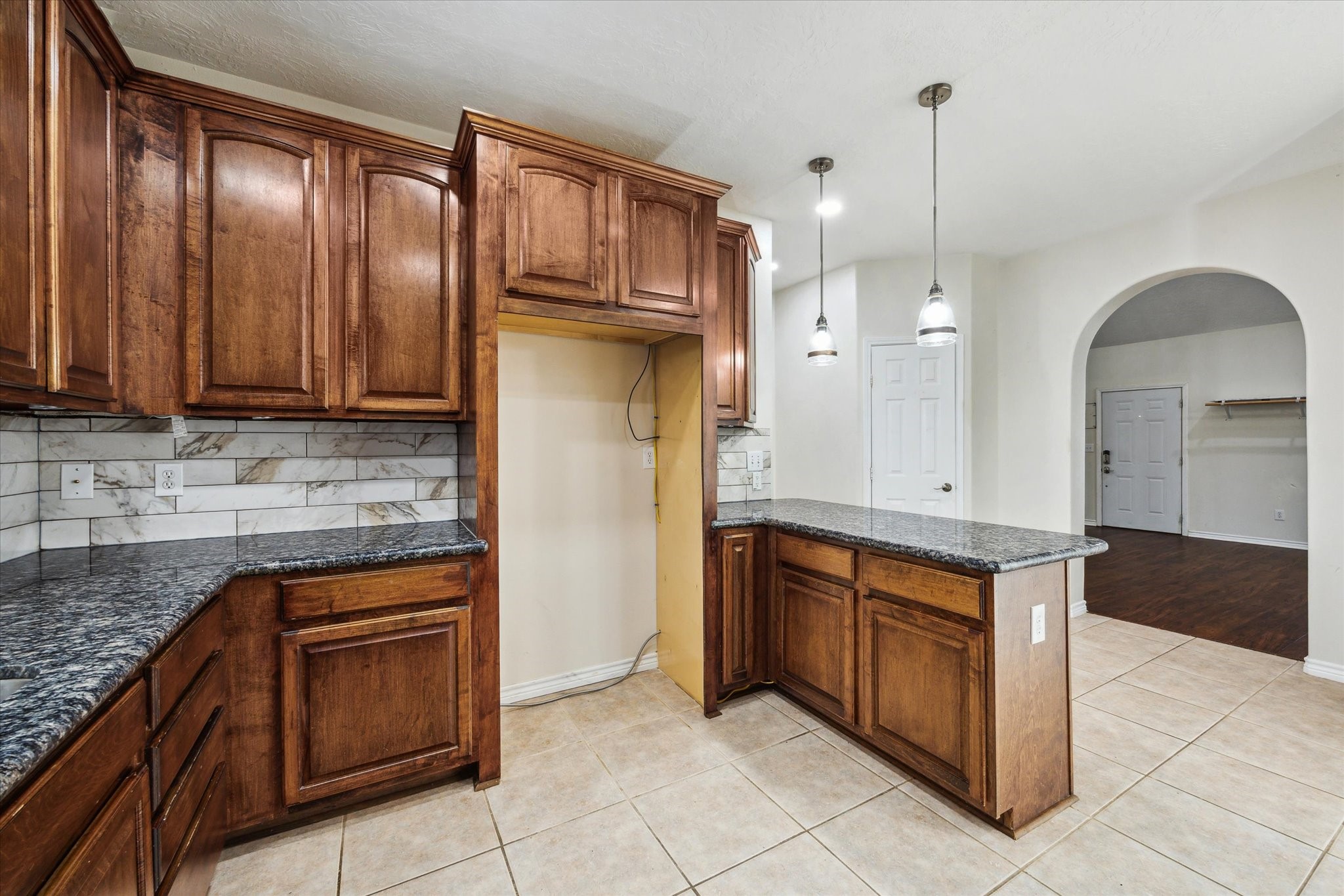 216 Rue Orleans Street Baytown, TX 77520 - Photo 12 of 43 a kitchen with stainless steel appliances granite countertop a refrigerator and a sink
