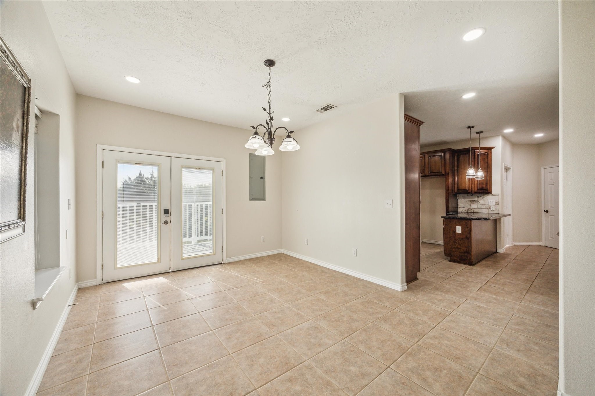 216 Rue Orleans Street Baytown, TX 77520 - Photo 17 of 43 a view of a kitchen with a sink and a large window