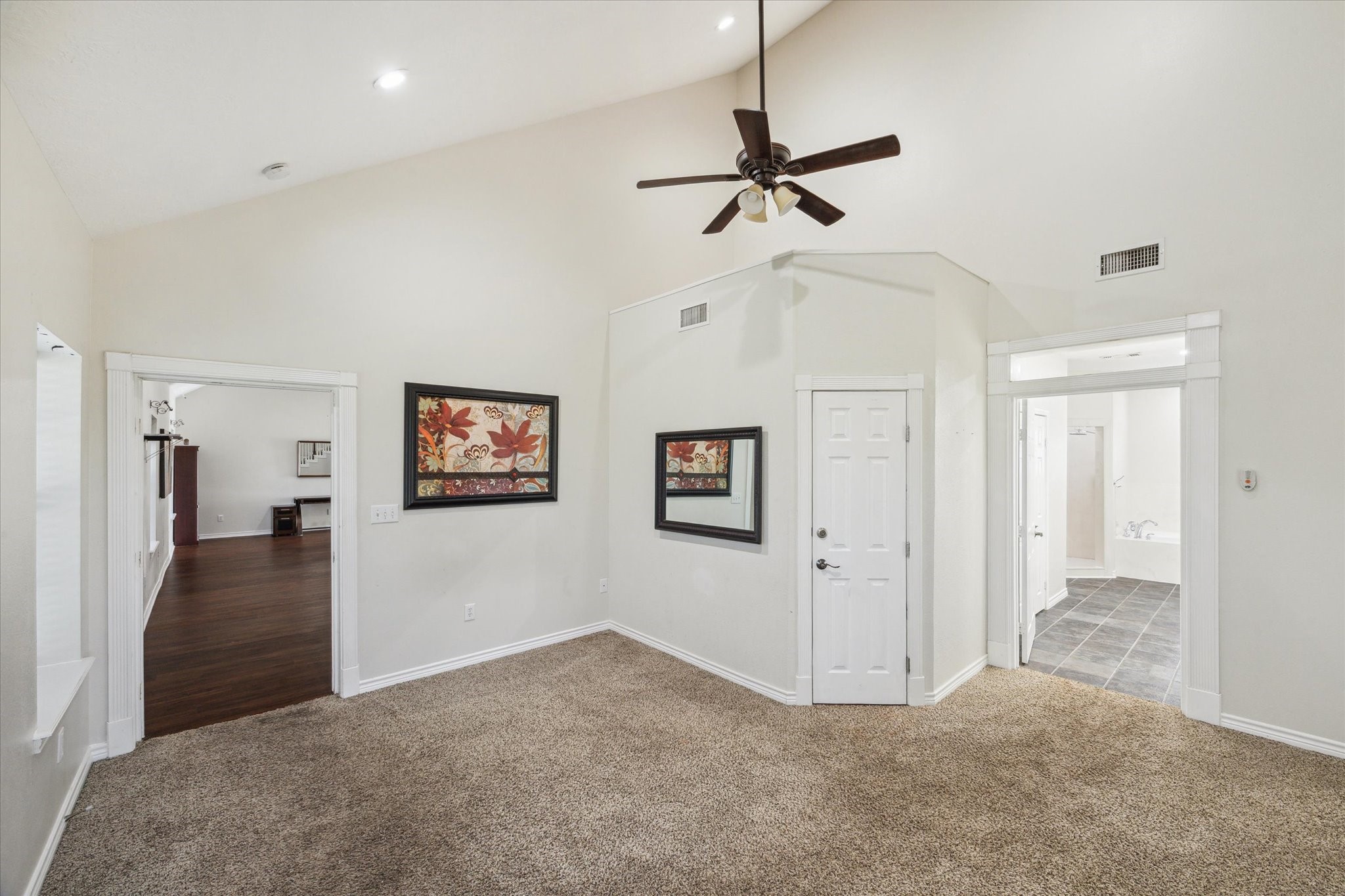 216 Rue Orleans Street Baytown, TX 77520 - Photo 19 of 43 a view of a livingroom with a chandelier fan and windows