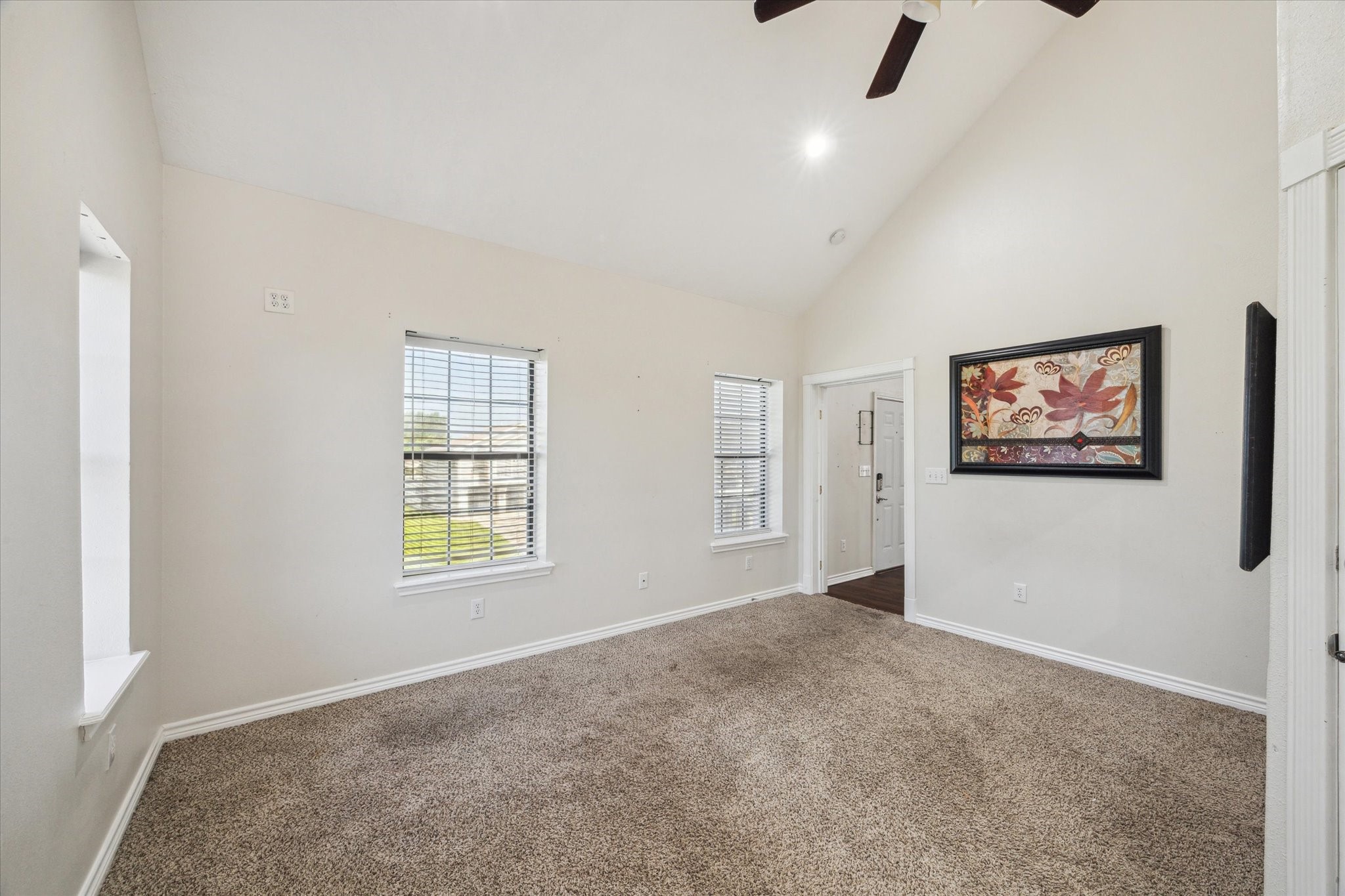 216 Rue Orleans Street Baytown, TX 77520 - Photo 20 of 43 an empty room with windows and fan