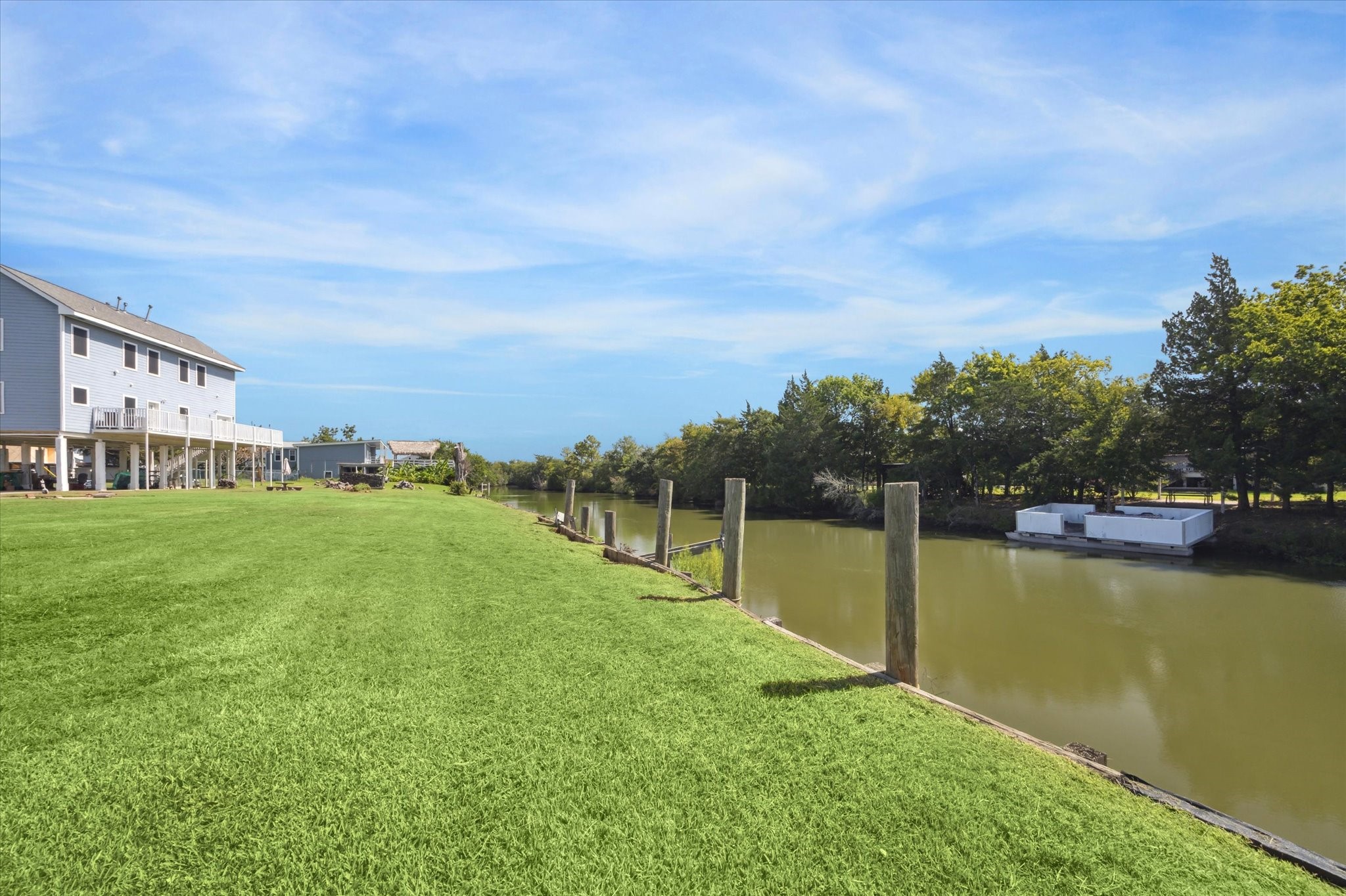 216 Rue Orleans Street Baytown, TX 77520 - Photo 2 of 43 a view of a lake with houses in the back
