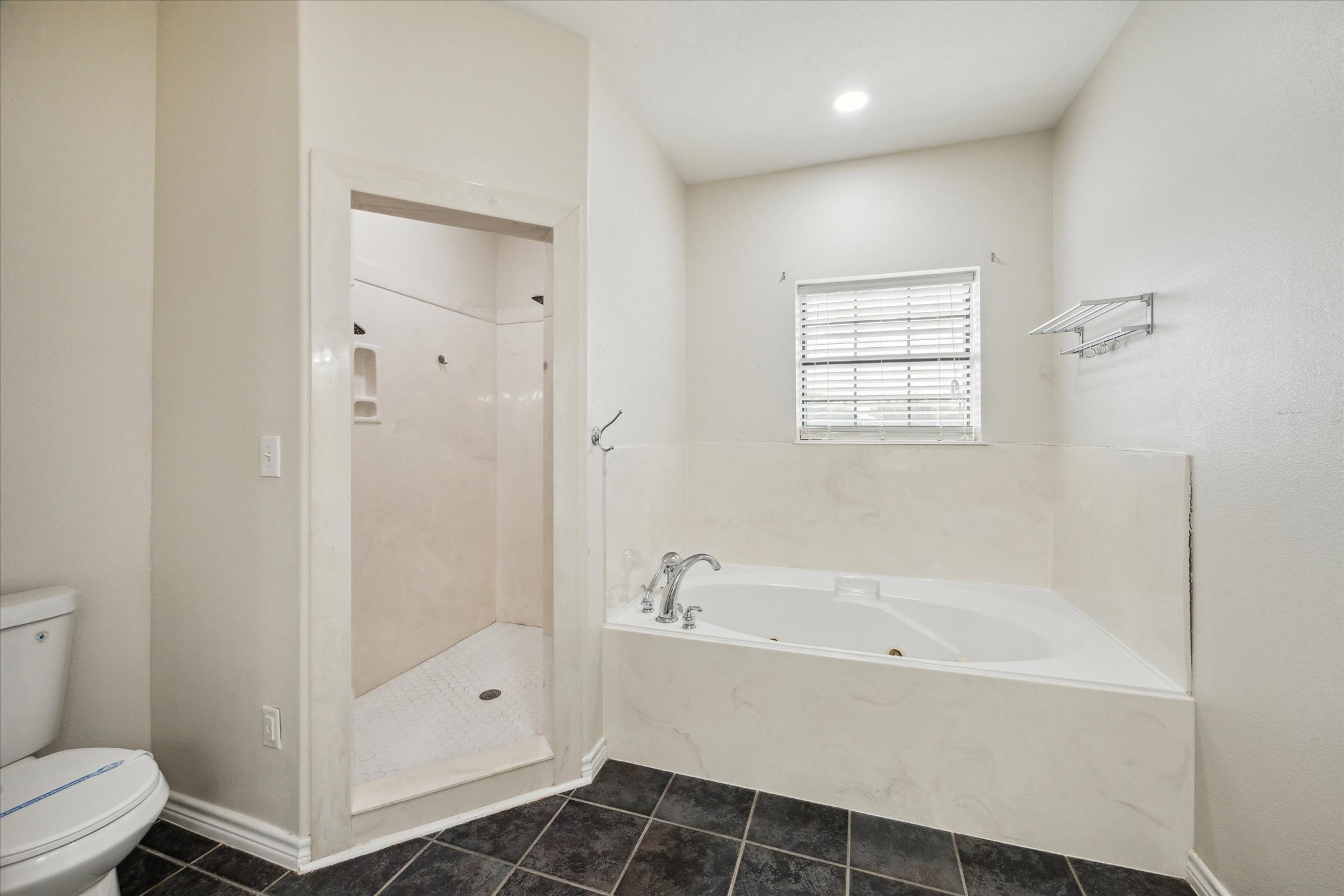 216 Rue Orleans Street Baytown, TX 77520 - Photo 22 of 43 a bathroom with a bathtub and a shower