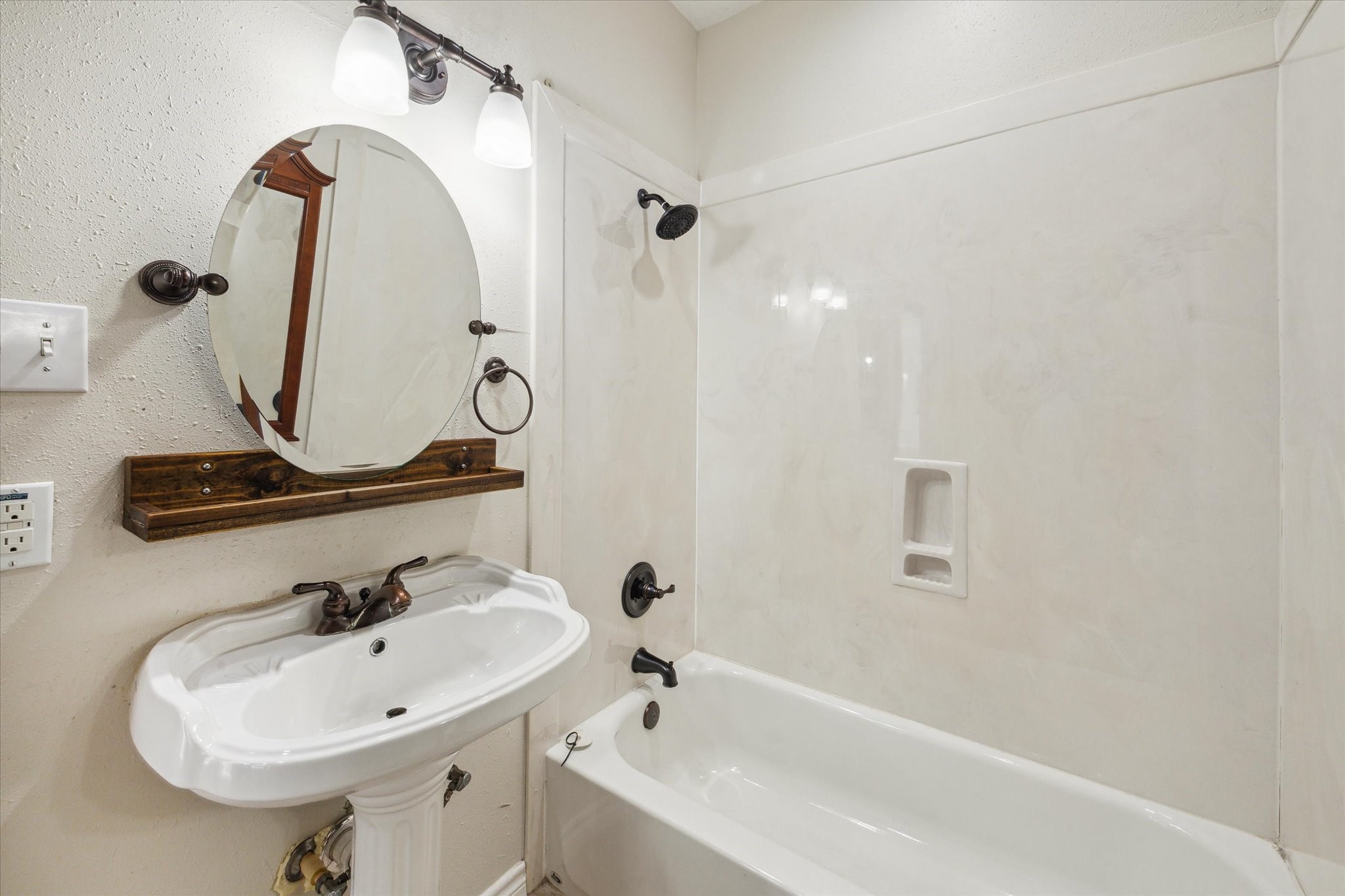 216 Rue Orleans Street Baytown, TX 77520 - Photo 26 of 43 a bathroom with a sink and mirror