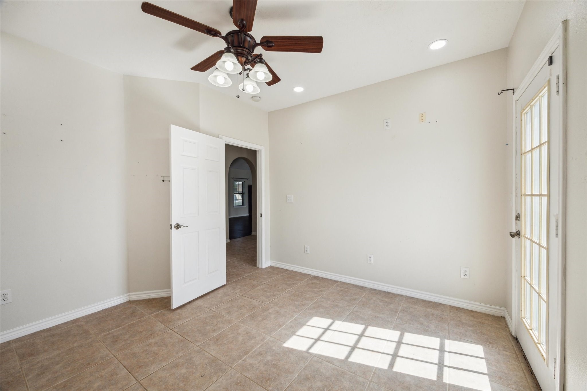 216 Rue Orleans Street Baytown, TX 77520 - Photo 28 of 43 an empty room with chandelier fan and windows