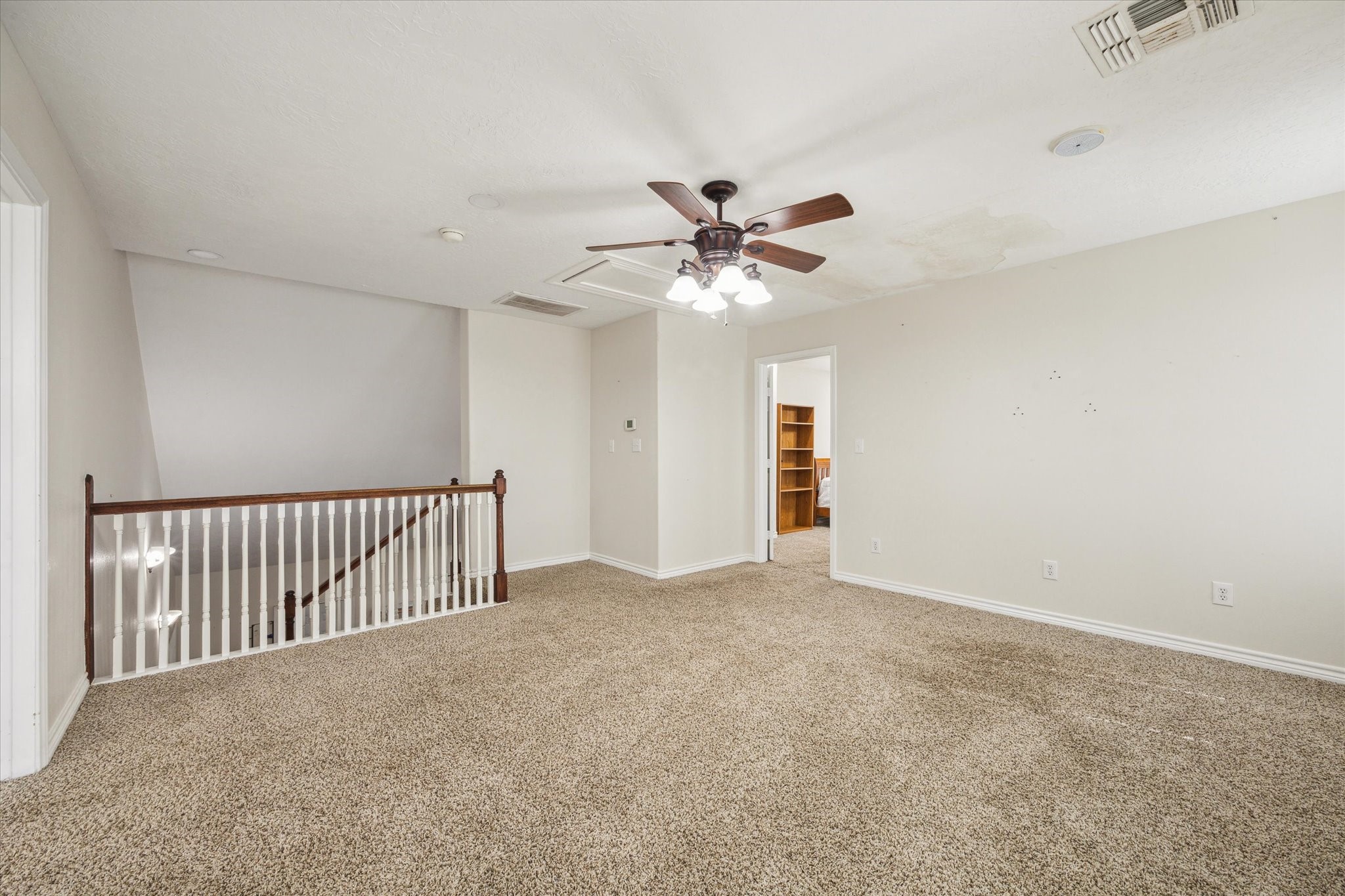 216 Rue Orleans Street Baytown, TX 77520 - Photo 31 of 43 a view of an empty room with a chandelier fan