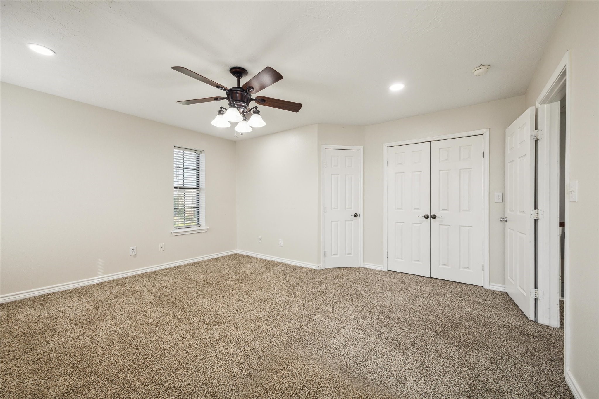216 Rue Orleans Street Baytown, TX 77520 - Photo 33 of 43 a view of an empty room with a window