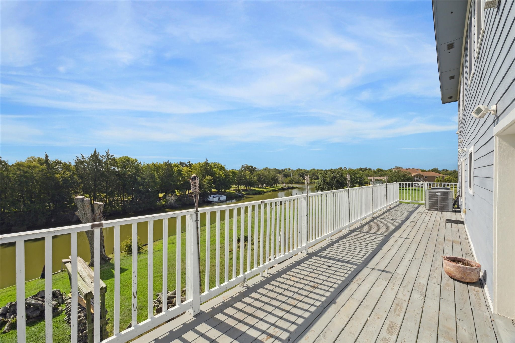 216 Rue Orleans Street Baytown, TX 77520 - Photo 39 of 43 a view of balcony with wooden floor and fence