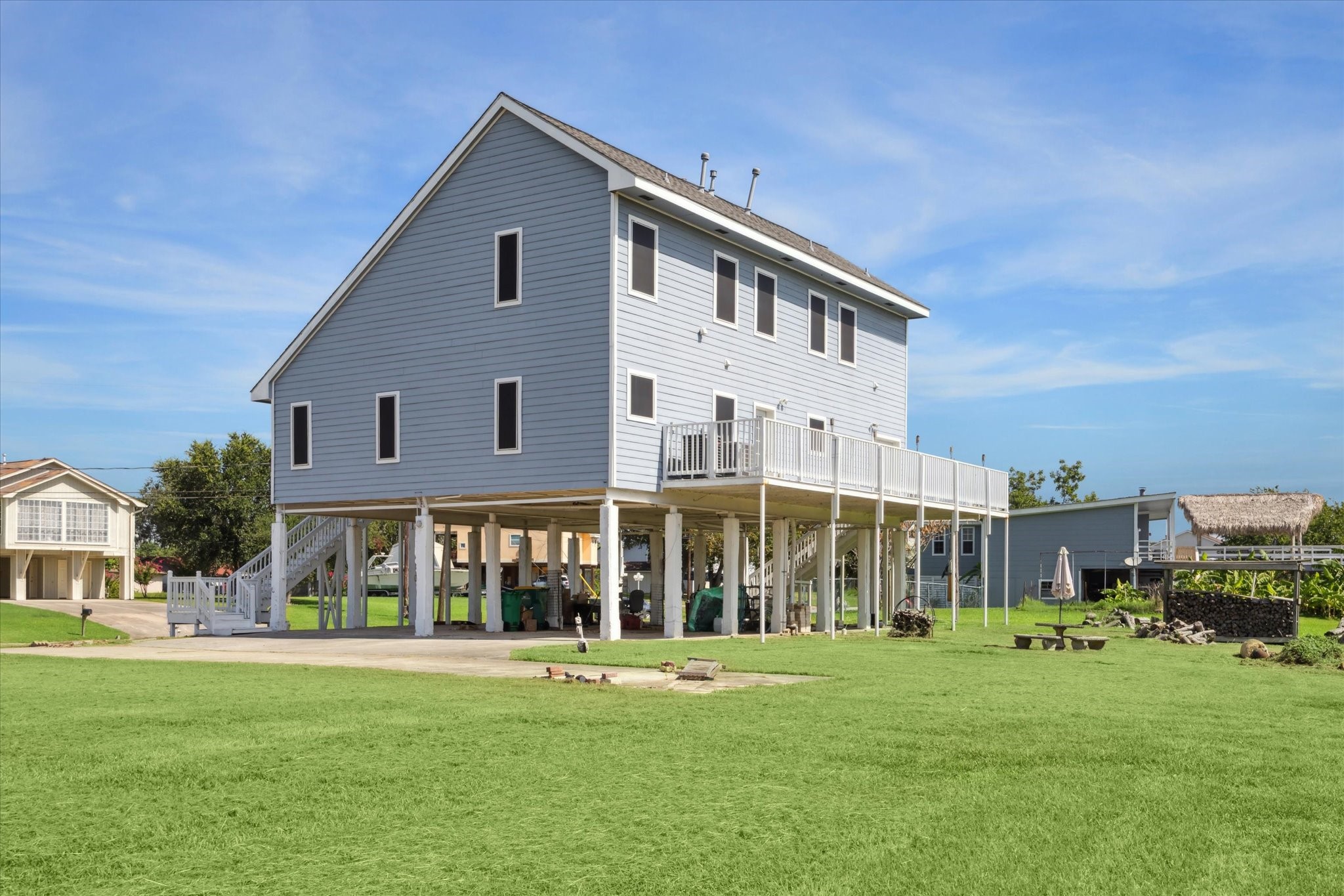 216 Rue Orleans Street Baytown, TX 77520 - Photo 42 of 43 a view of a big house with a big yard and large trees