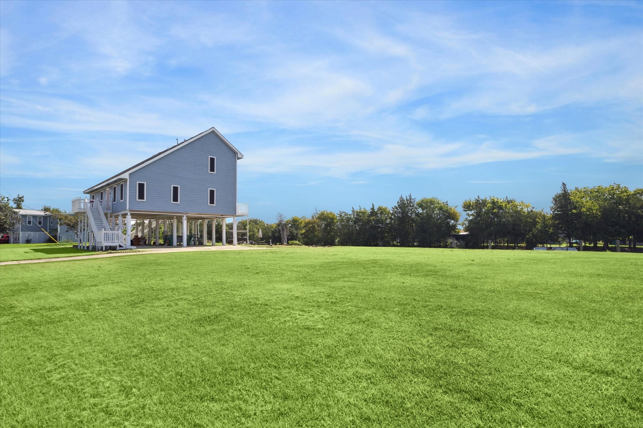 216 Rue Orleans Street Baytown, TX 77520 - Photo 6 of 43 a view of a big house with a big yard
