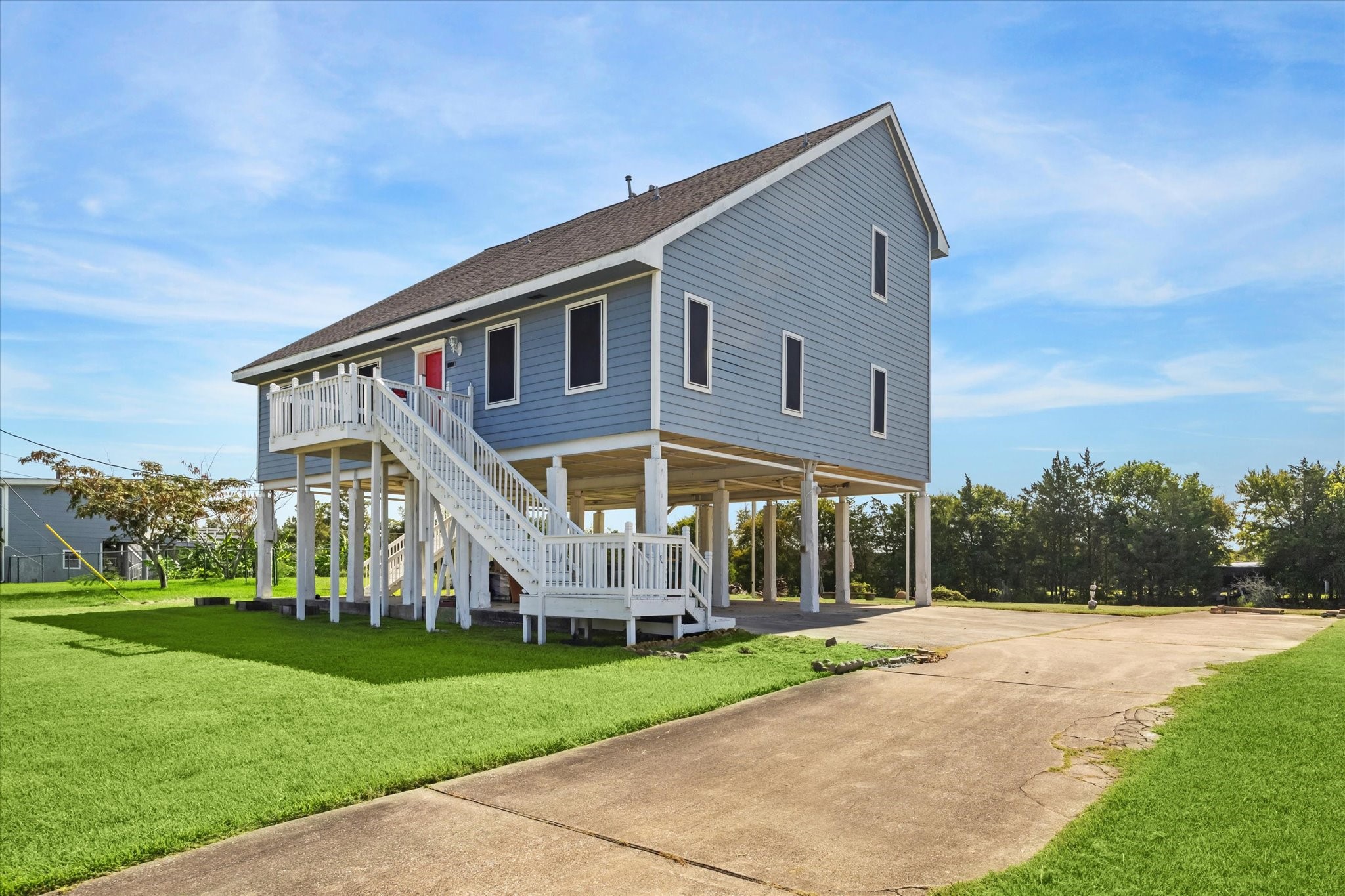 216 Rue Orleans Street Baytown, TX 77520 - Photo 7 of 43 a front view of house with yard and green space