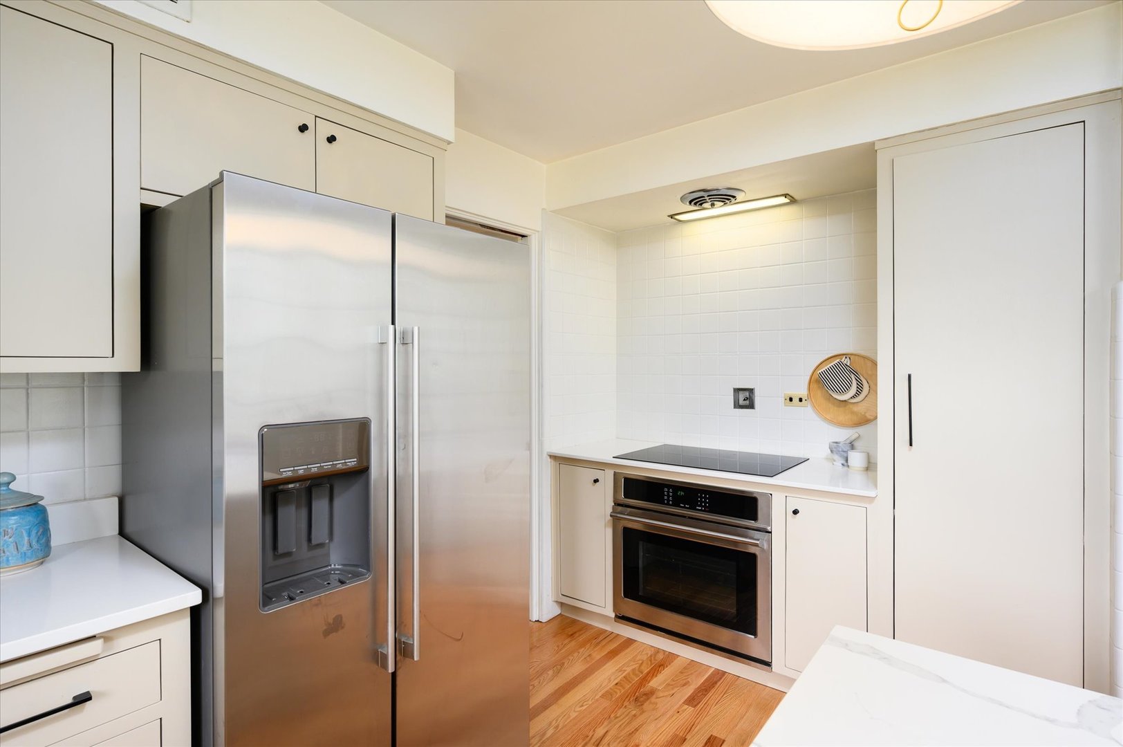 277 Olmsted Road Riverside, IL 60546 - Photo 13 of 34 a kitchen with a refrigerator and a stove