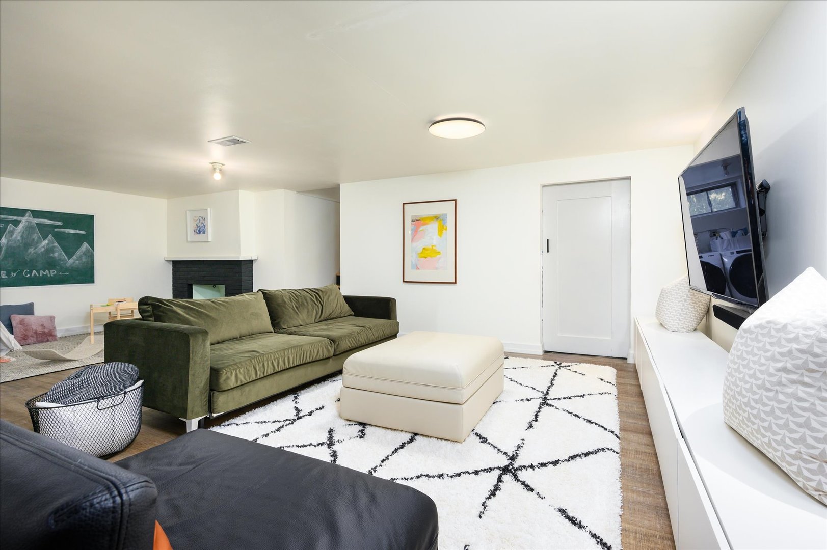 277 Olmsted Road Riverside, IL 60546 - Photo 21 of 34 a living room with furniture and a flat screen tv