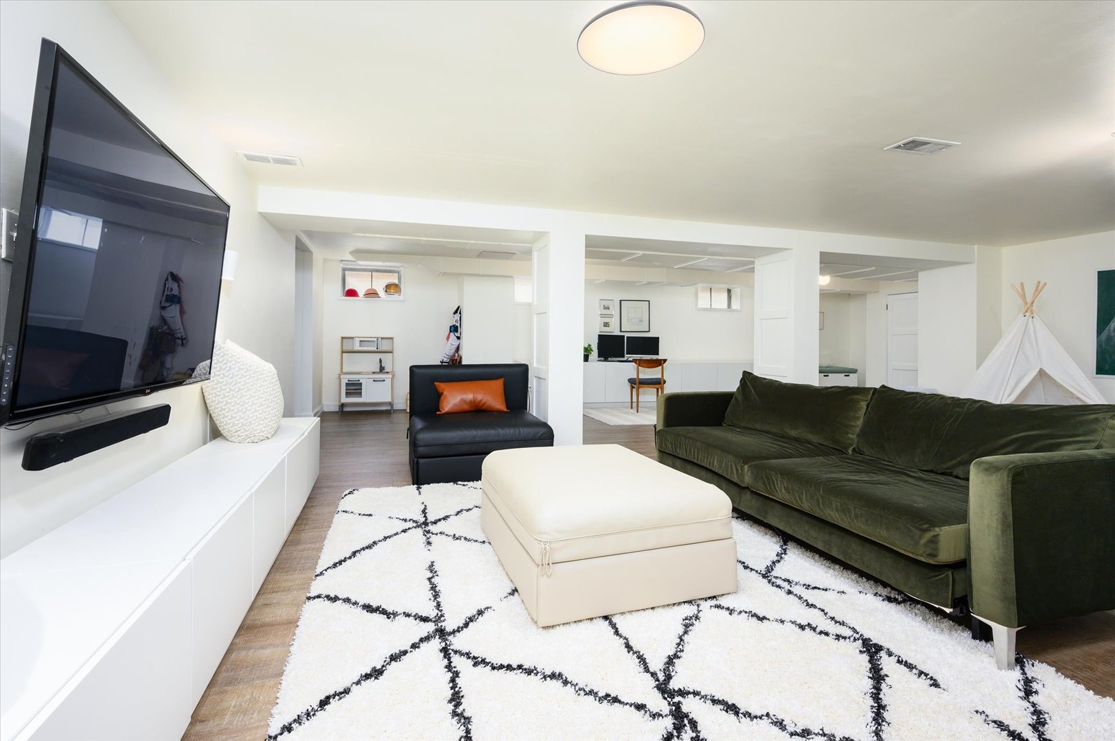 277 Olmsted Road Riverside, IL 60546 - Photo 22 of 34 a living room with furniture a flat screen tv and a couch