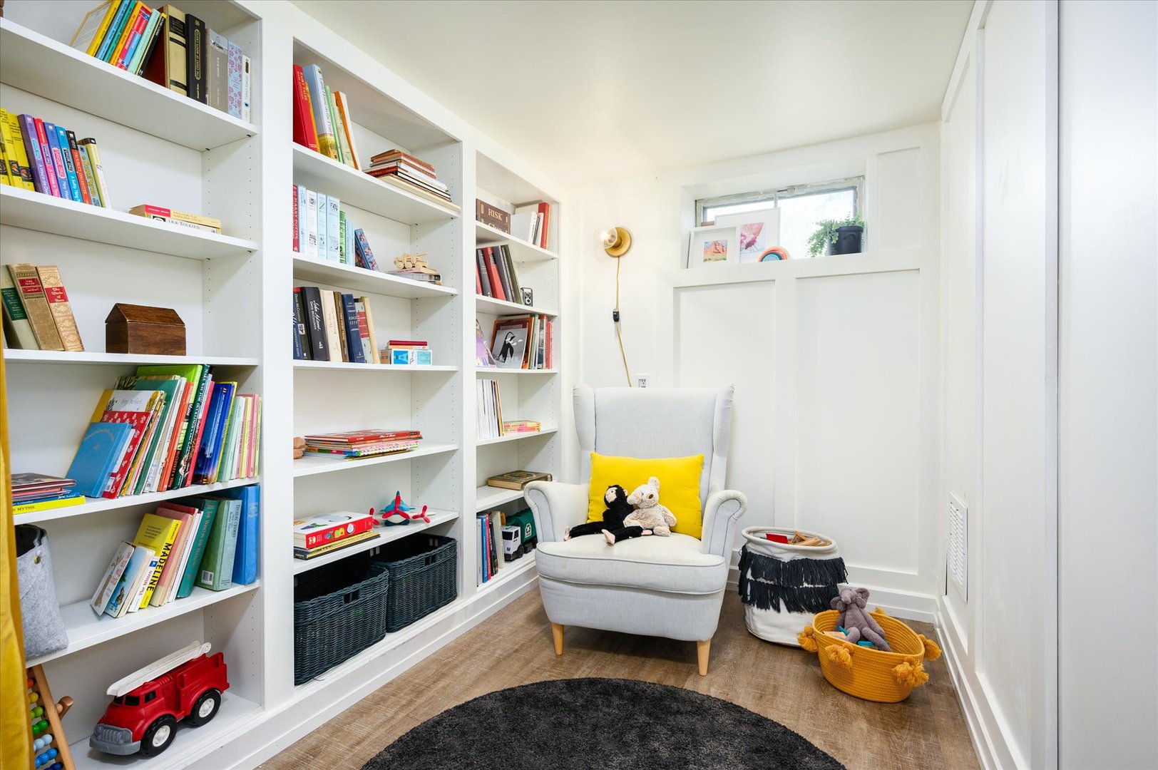 277 Olmsted Road Riverside, IL 60546 - Photo 28 of 34 a living room with lots of furniture and a book shelf