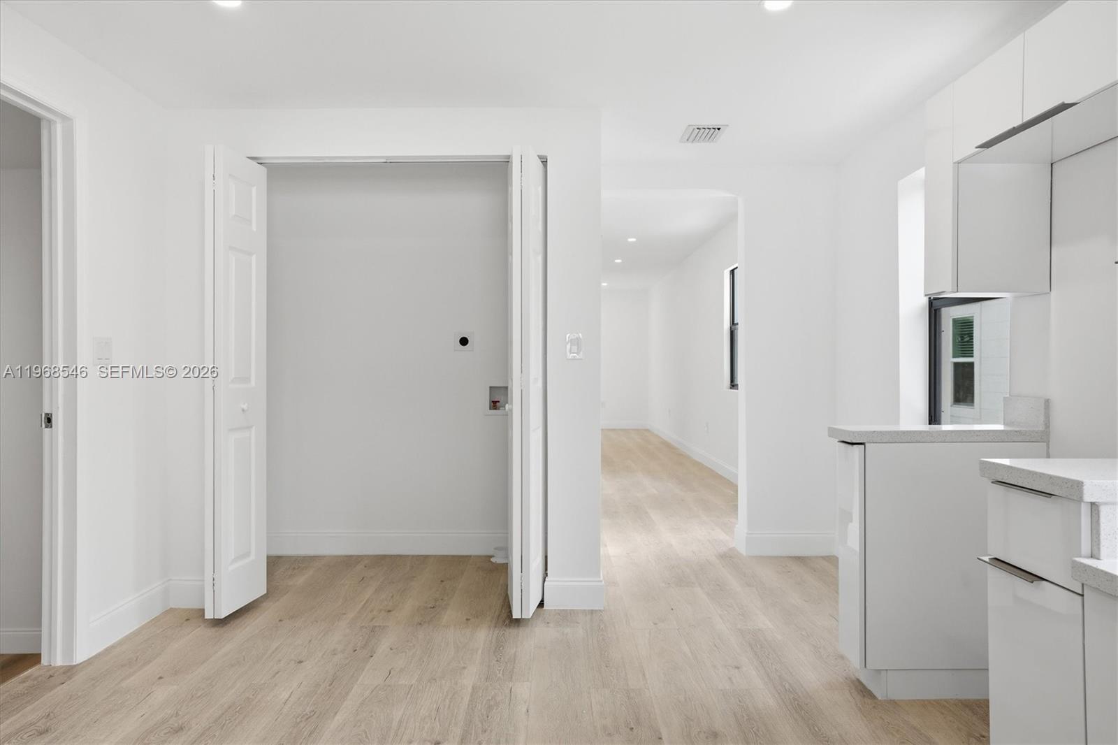 4237 Southwest 7th Street Miami, FL 33134 - Photo 10 of 31 a view of empty room with wooden floor and cabinet
