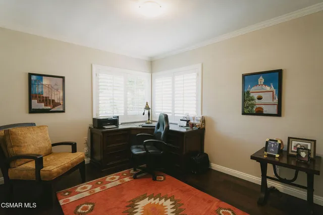 a bedroom with a bed and furniture