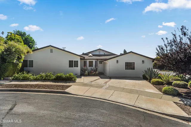 a view of a couches and a fire pit in the patio