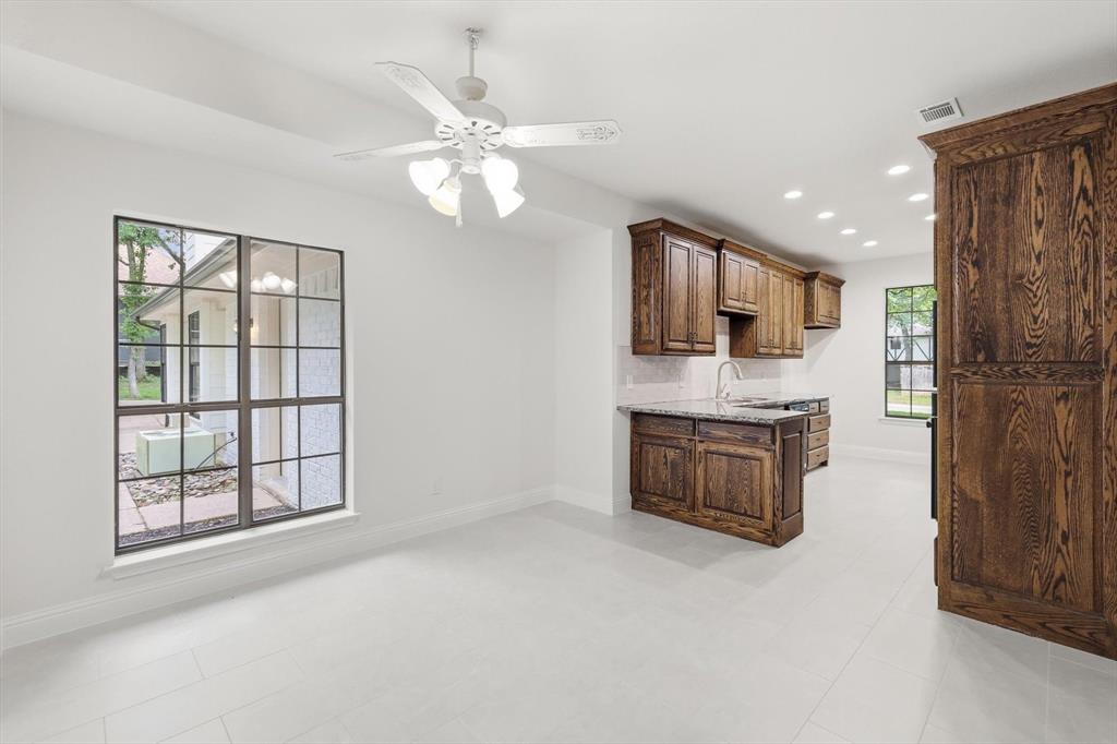 19 Timbergreen Circle Denton, TX 76205 - Photo 10 of 40 a kitchen with a refrigerator and a sink