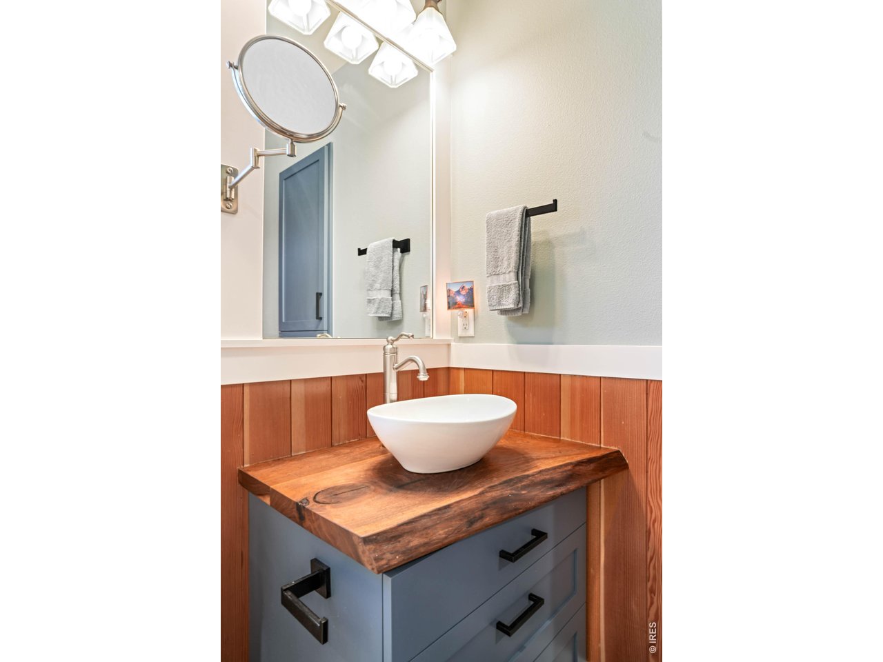 1321 9th Street, Unit A Boulder, CO 80302 - Photo 16 of 45 a bathroom with a granite countertop sink and a mirror