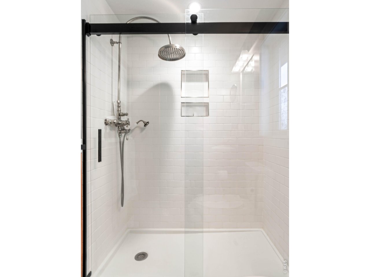 1321 9th Street, Unit A Boulder, CO 80302 - Photo 17 of 45 a bathroom with a glass shower door