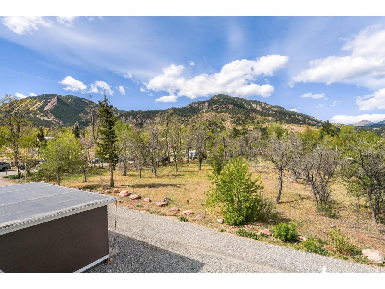 1321 9th Street, Unit A Boulder, CO 80302 - Photo 29 of 45 a view of a town with mountains in the background