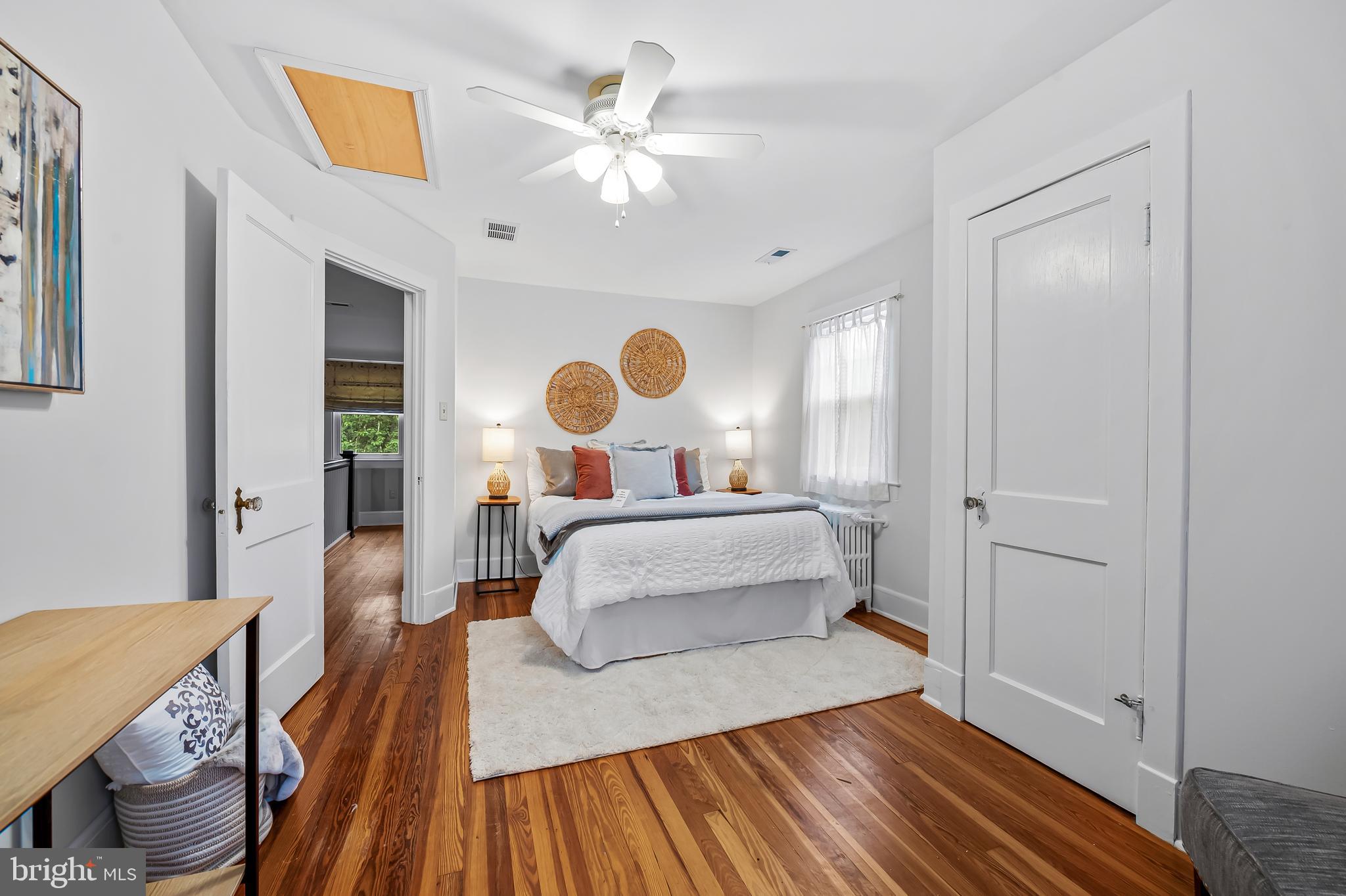 529 Overbrook Road Baltimore, MD 21212 - Photo 30 of 40 a bedroom with a bed and wooden floor