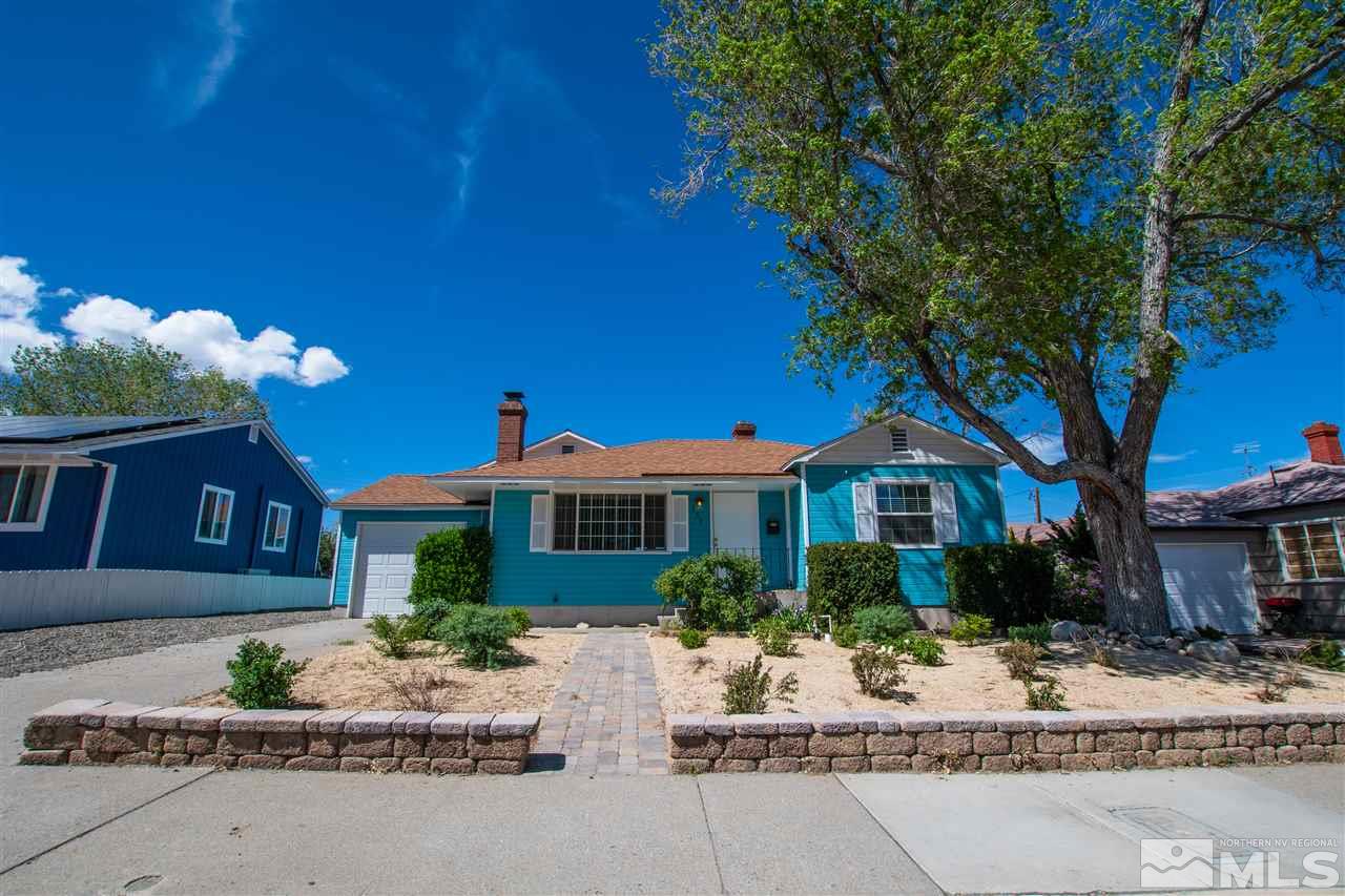 255 West Plumb Lane, Unit NV Reno, NV 89509 - Photo 3 of 25 a front view of a house with garden