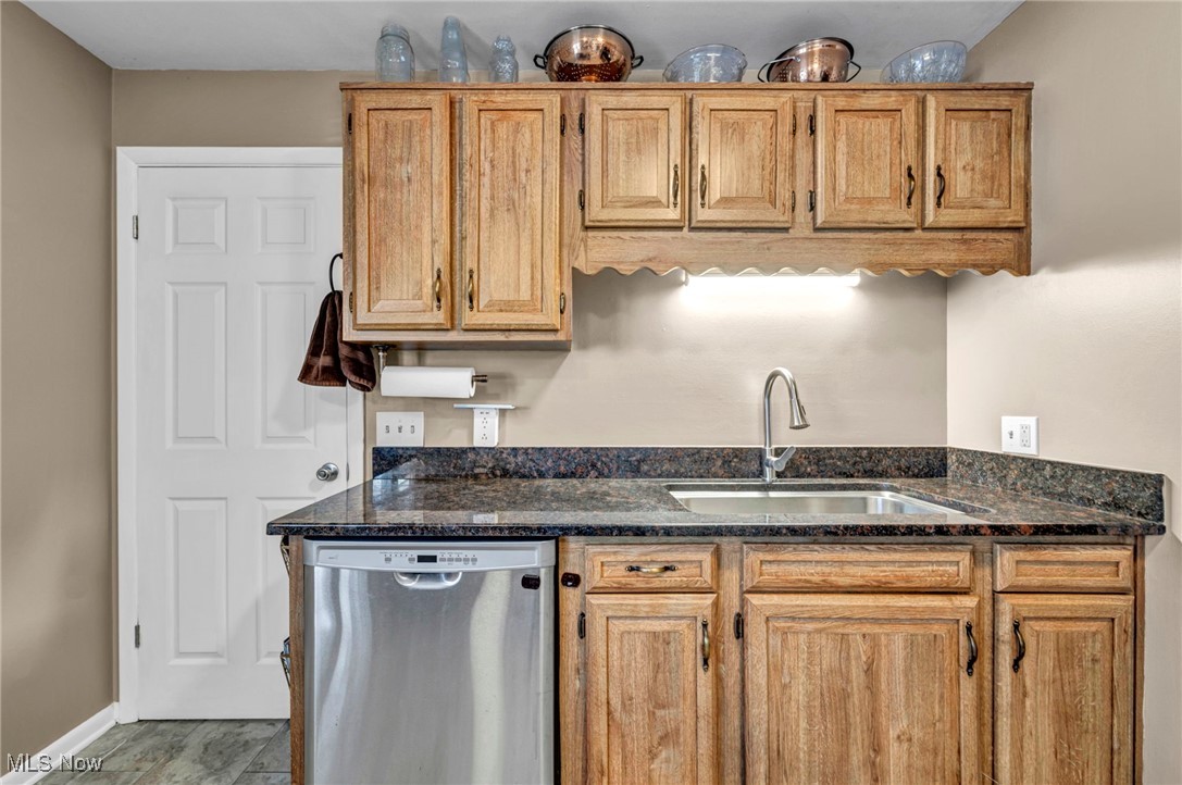 36462 Chestnut Ridge Road North Ridgeville, OH 44039 - Photo 16 of 47 Kitchen featuring dishwasher and dark stone counters