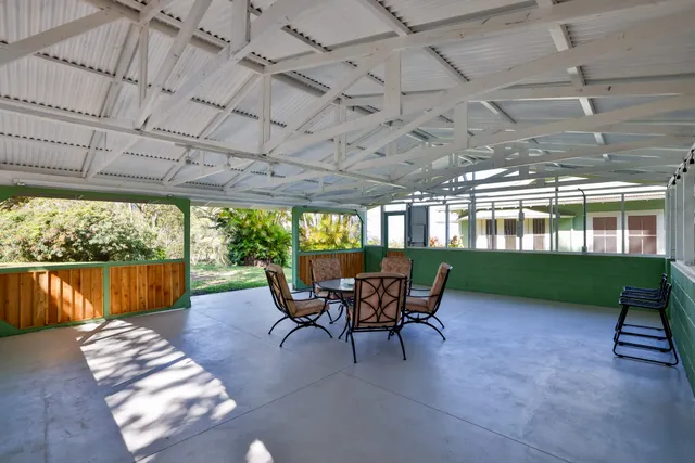 a living room with furniture fireplace and window