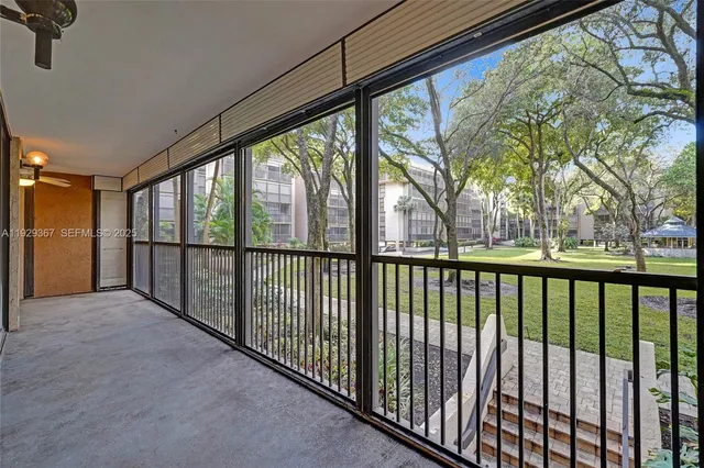 an aerial view of residential houses with outdoor space and lake view