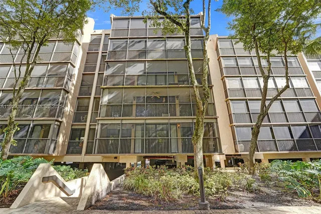 a view of a lake with houses in the back