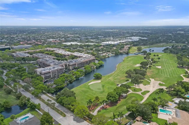 a view of a dining room with furniture wooden floor and chandelier