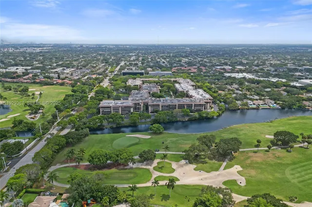 a street sign on a wall next to a road