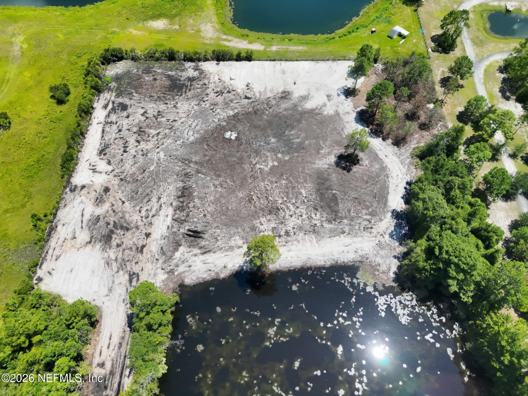 0 Quail Road Callahan, FL 32011 - Photo 3 of 7 a view of a yard with an outdoor space
