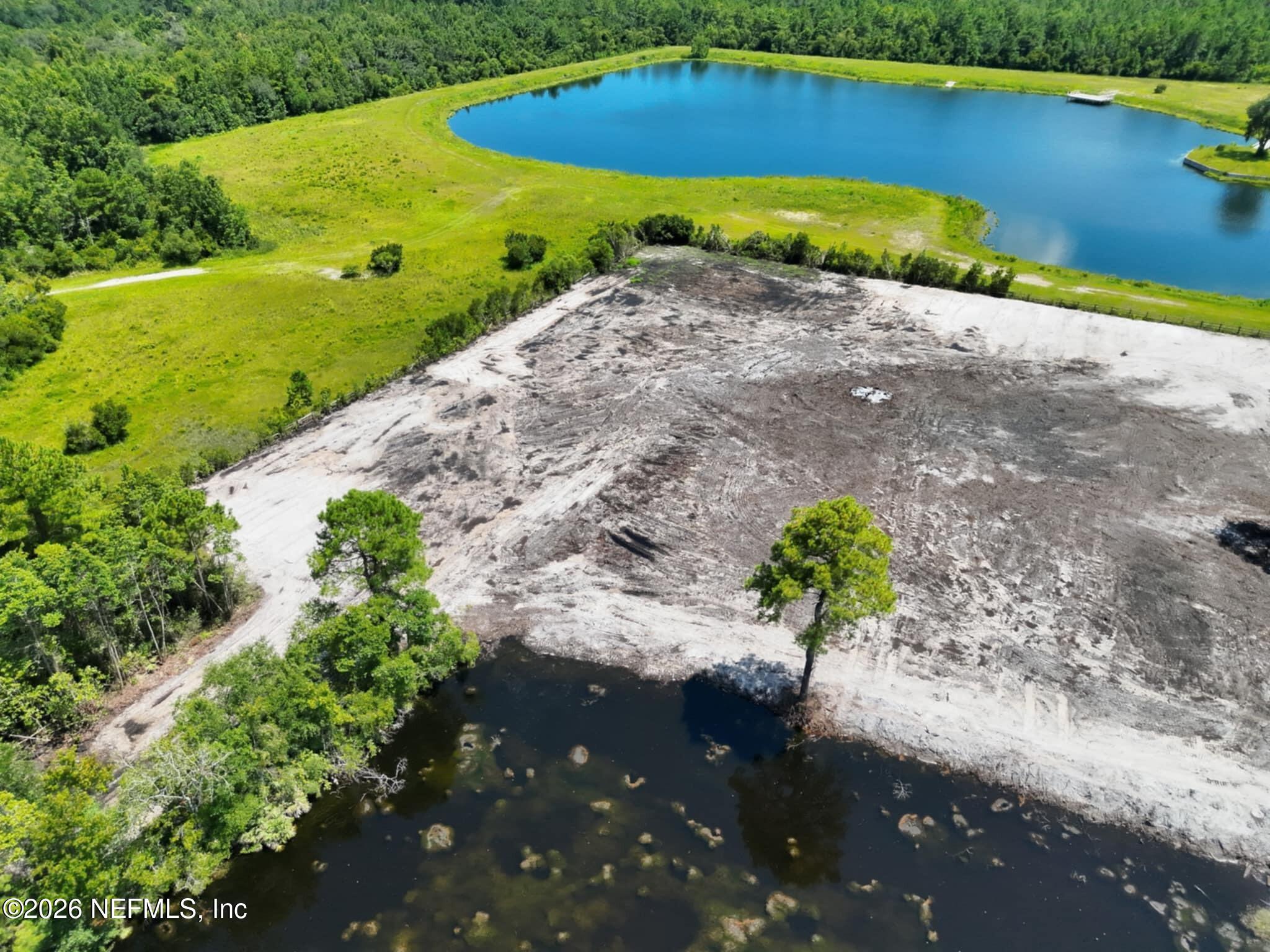 0 Quail Road Callahan, FL 32011 - Photo 6 of 7 a view of a lake with outdoor space
