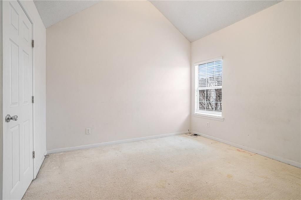 1915 Cornerstone Pass Way Conyers, GA 30012 - Photo 18 of 25 an empty room with windows