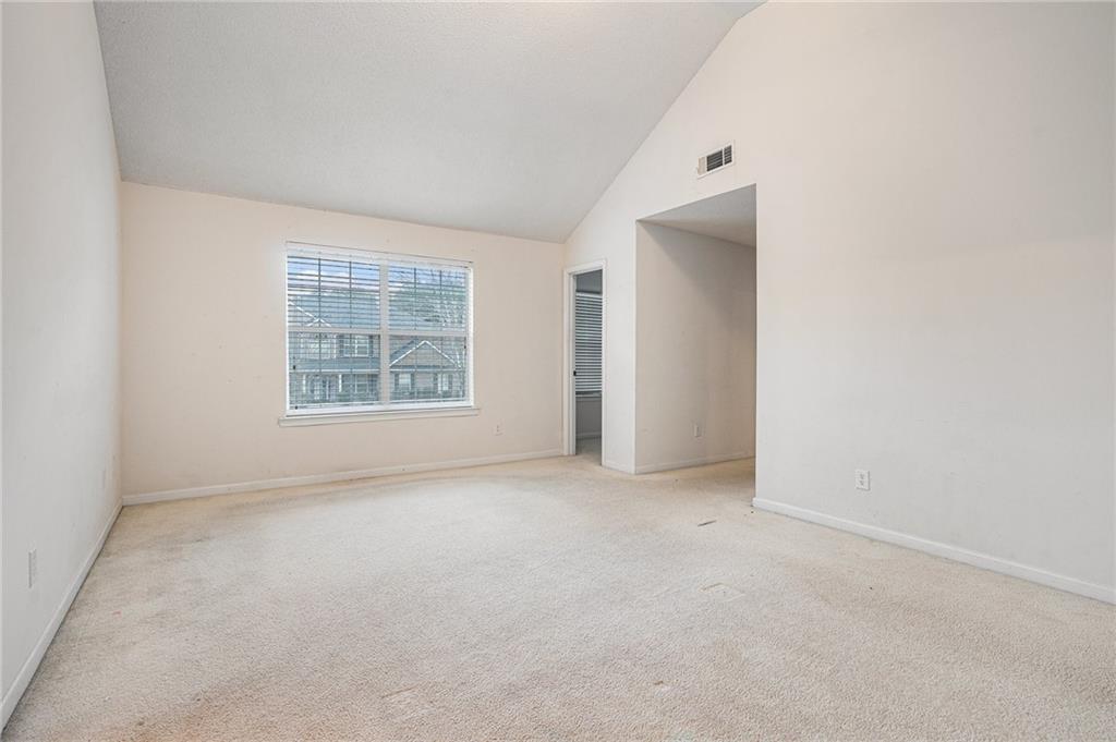 1915 Cornerstone Pass Way Conyers, GA 30012 - Photo 20 of 25 an empty room with windows and closet