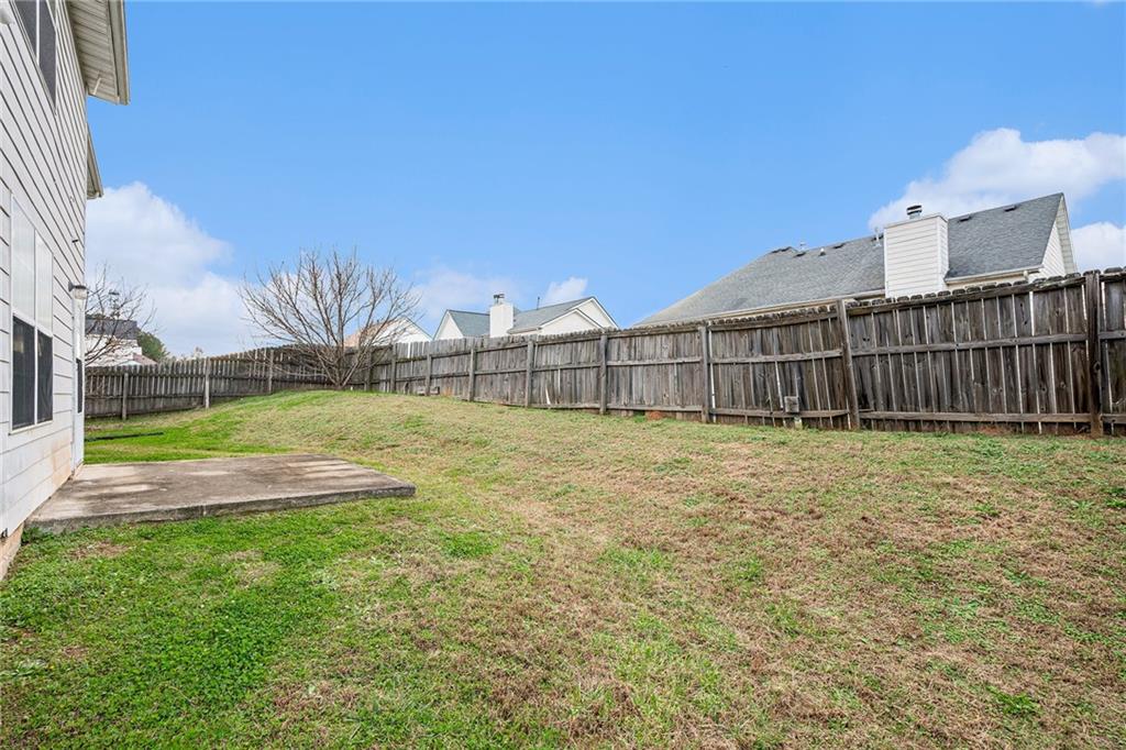 1915 Cornerstone Pass Way Conyers, GA 30012 - Photo 24 of 25 a view of a backyard with a garden