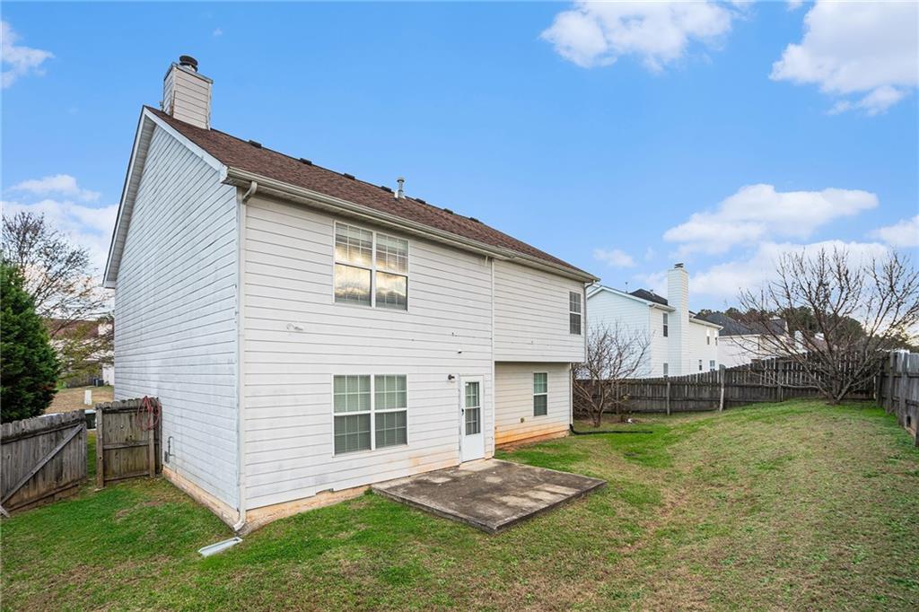 1915 Cornerstone Pass Way Conyers, GA 30012 - Photo 25 of 25 a view of a house with backyard