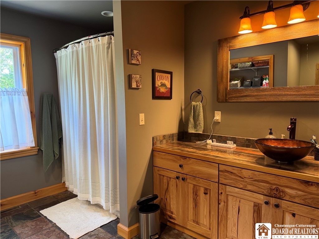 9039 Kidder Road Mina, NY 14781 - Photo 35 of 48 Bathroom tub/shower and vessel sink
