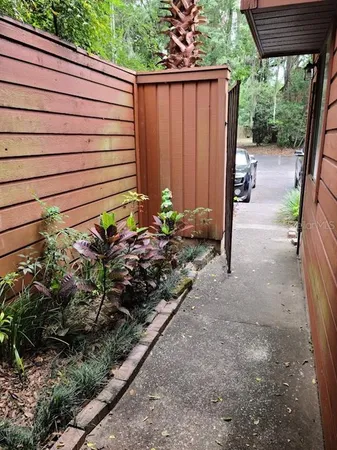 a view of a backyard with pathway