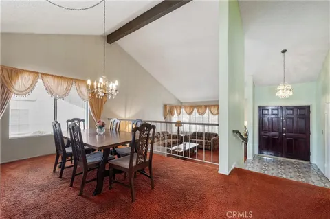 a view of a bedroom with furniture and staircase