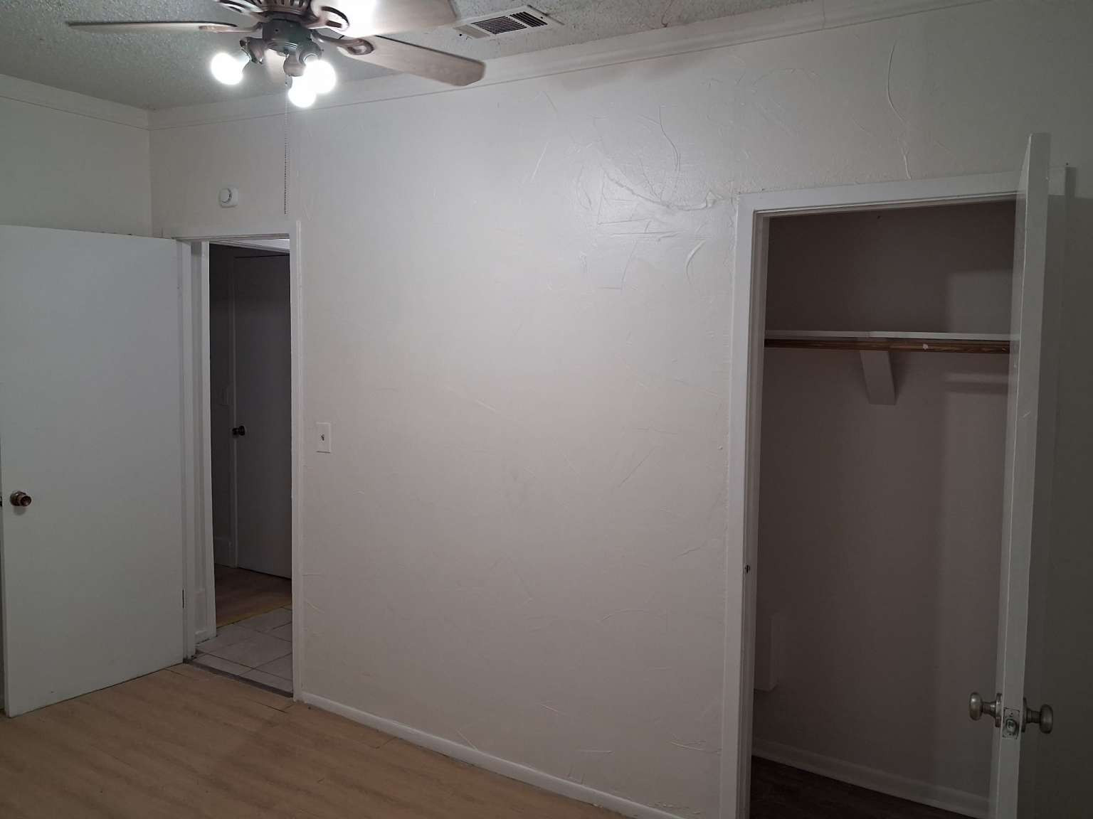 308 North Ridge Street Lampasas, TX 76550 - Photo 13 of 16 a view of an empty room with a chandelier fan
