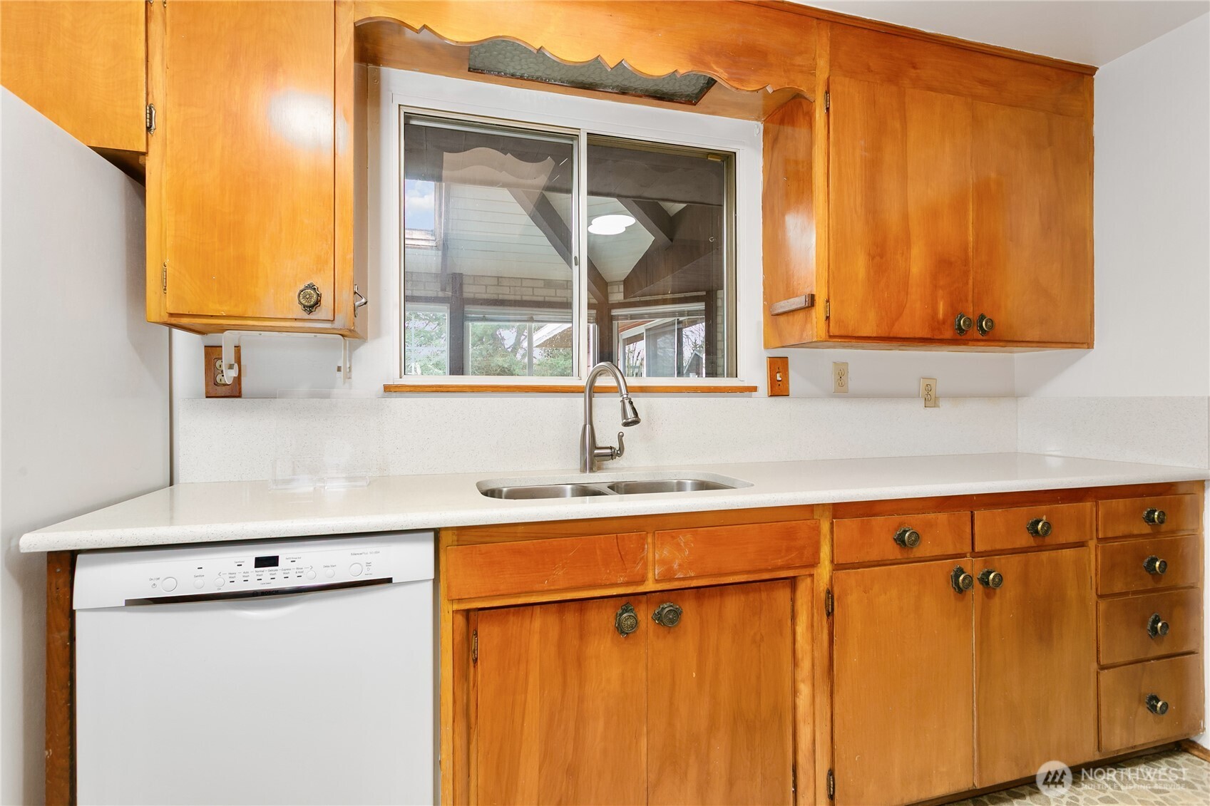 7416 25th Street West Tacoma, WA 98466 - Photo 13 of 39 a kitchen with a sink and a window