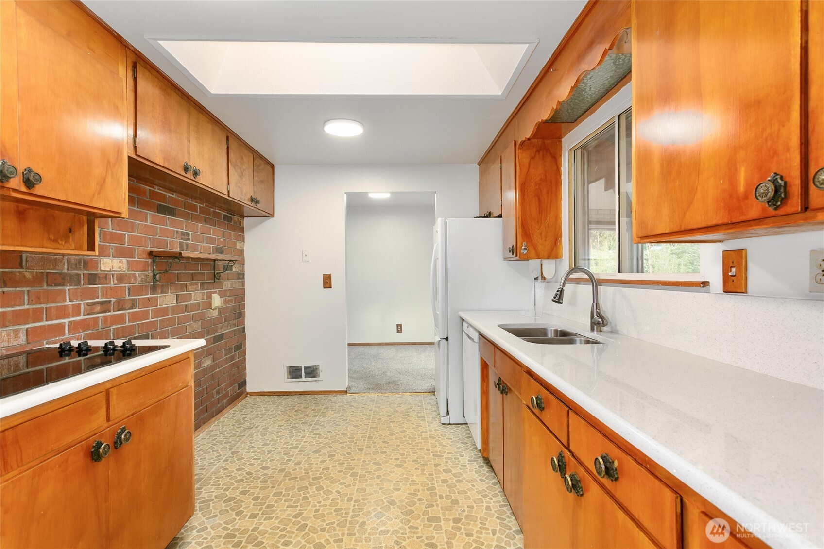 7416 25th Street West Tacoma, WA 98466 - Photo 16 of 39 a large bathroom with a granite countertop double vanity sink a mirror and a bathtub