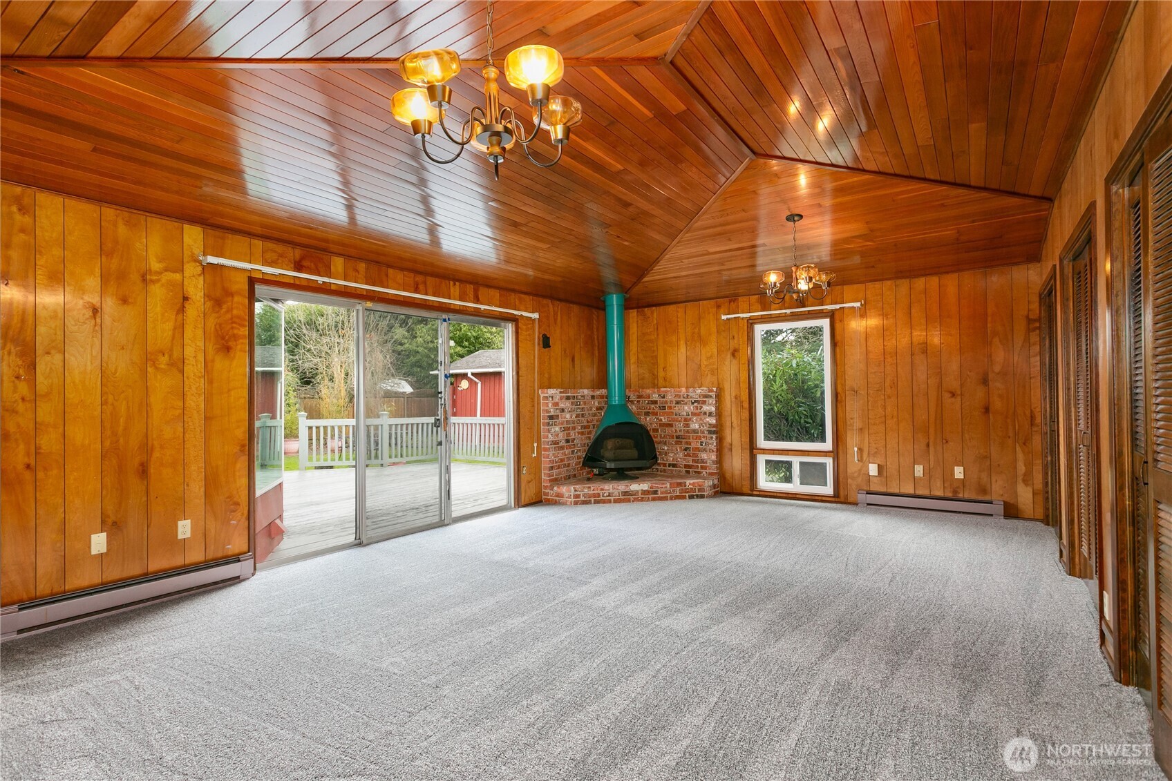 7416 25th Street West Tacoma, WA 98466 - Photo 18 of 39 a view of a room with sliding door and wooden floor
