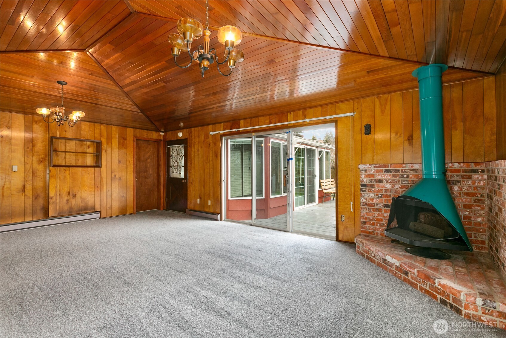 7416 25th Street West Tacoma, WA 98466 - Photo 19 of 39 a view of a livingroom with wooden floor and a ceiling fan