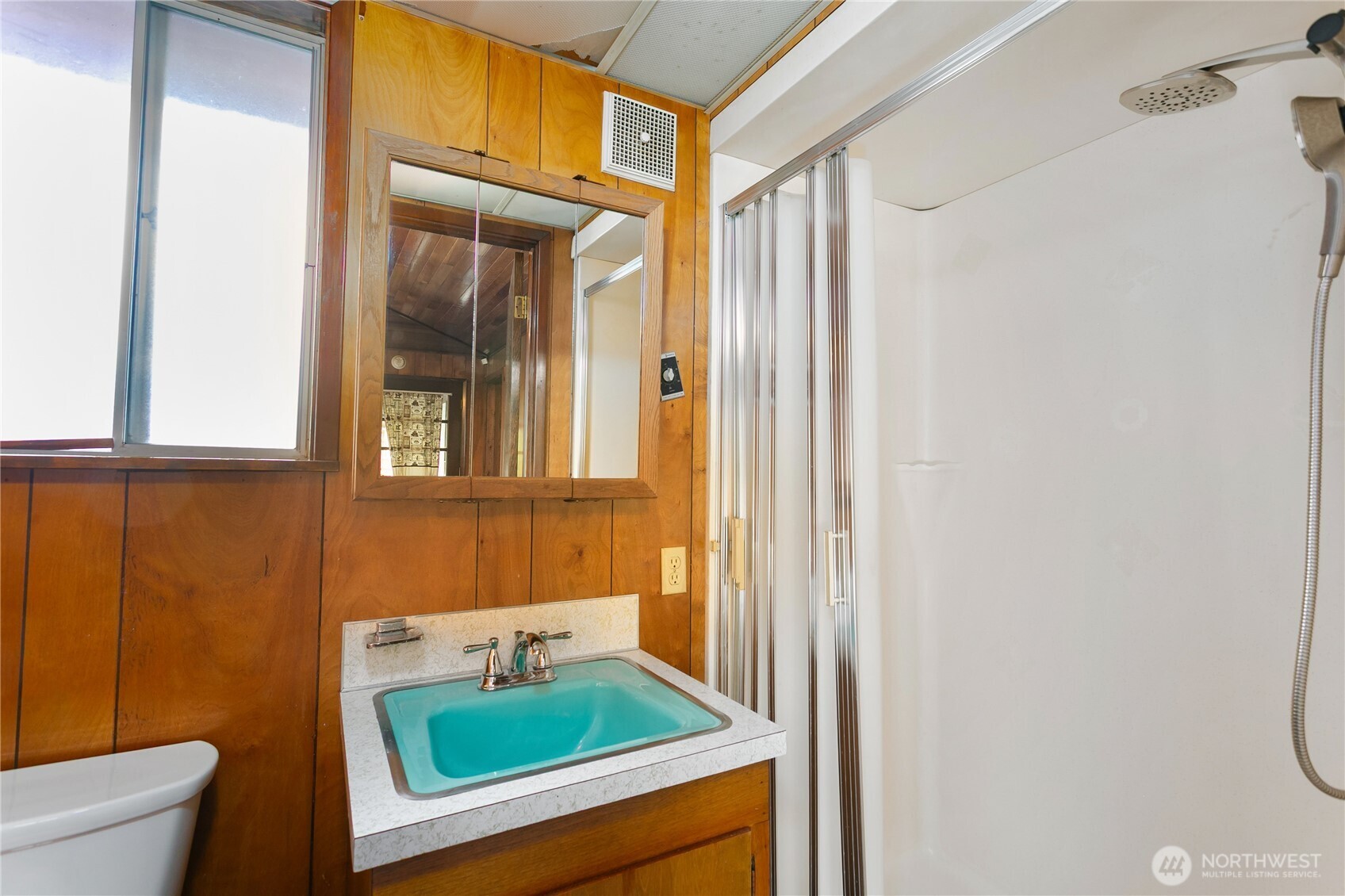 7416 25th Street West Tacoma, WA 98466 - Photo 21 of 39 a bathroom with a sink a toilet and shower