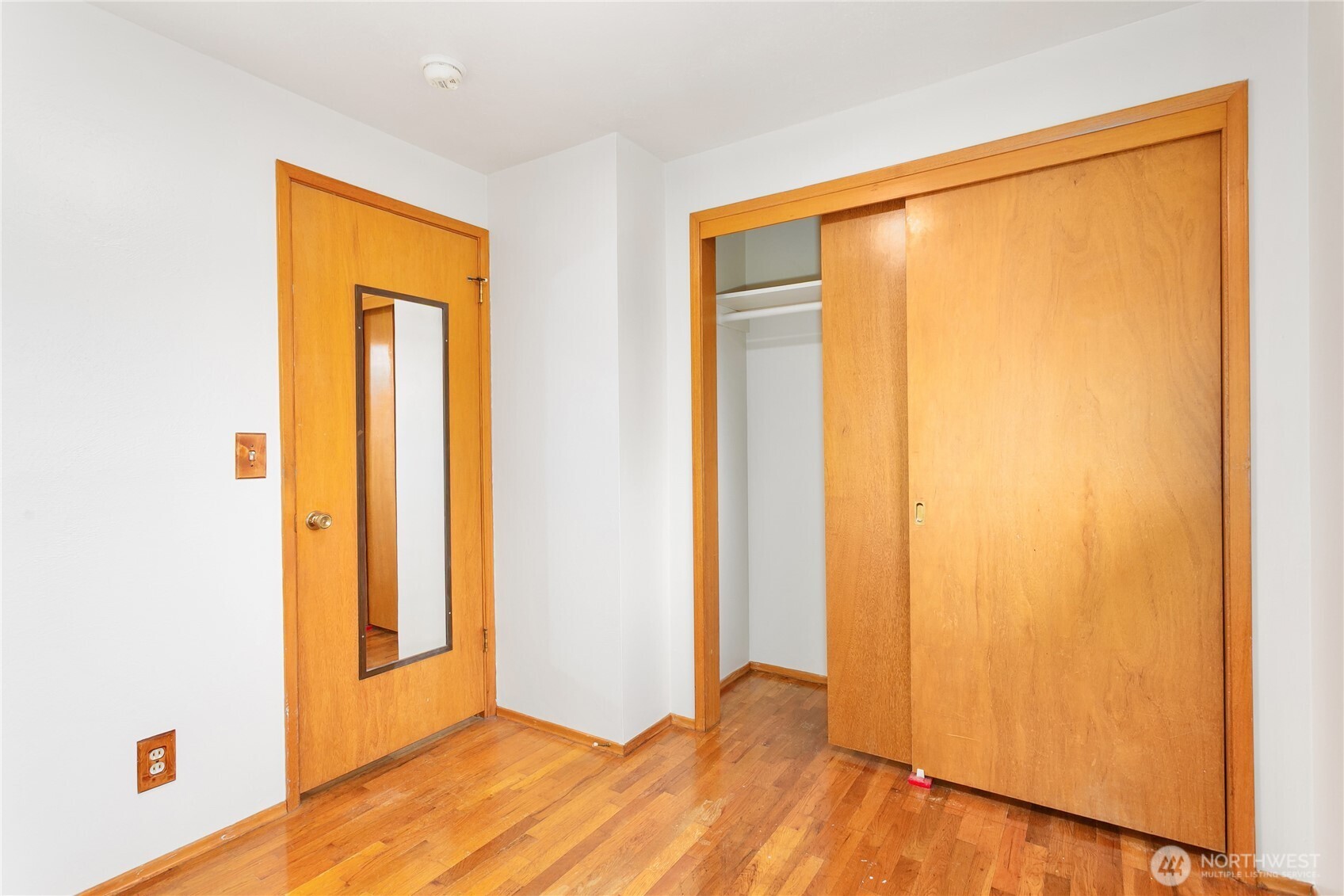 7416 25th Street West Tacoma, WA 98466 - Photo 26 of 39 a view of an empty room with wooden floor and a window